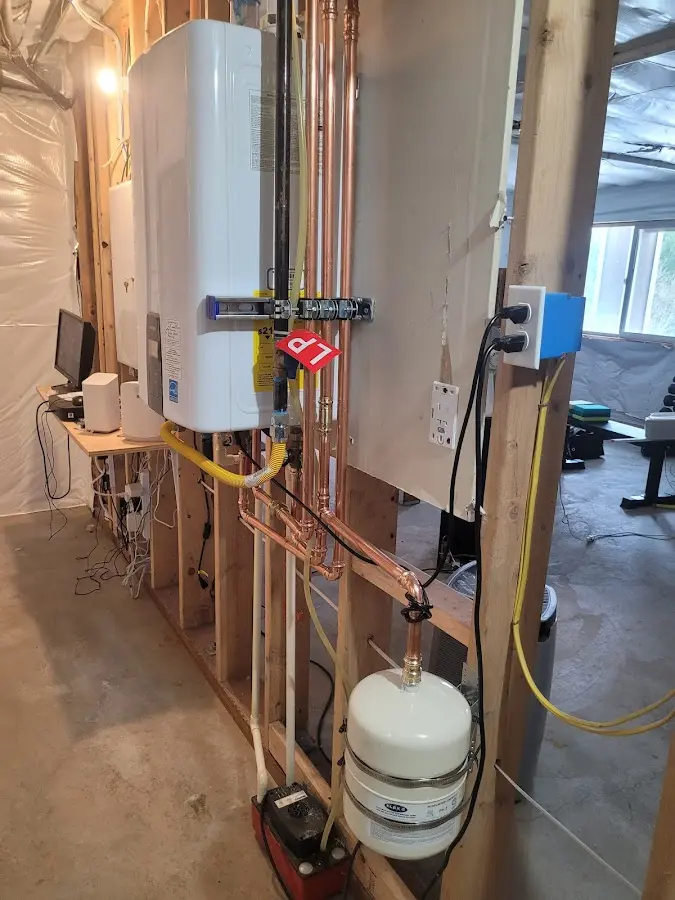 Licensed plumber repairing a kitchen sink in Zimmerman